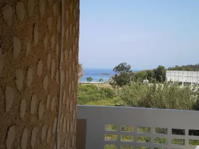 a view of the ocean from the balcony of a house at Beachway home in Kato Daratso