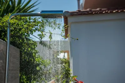 a building with a door with water on it at Thea Thalassa in Kalamaki Chanion