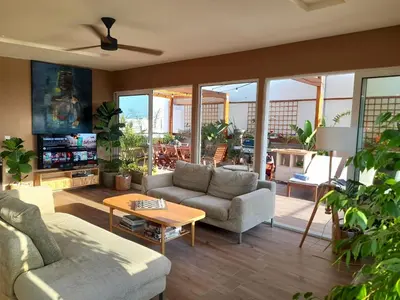 a living room with a couch and a table at ChaniaStay Central Apartments in Chania Town