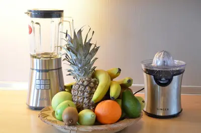 a bowl of fruit on a table next to a blender at ChaniaStay Central Apartments in Chania Town