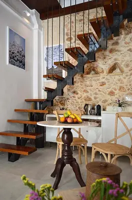 a kitchen with a table with fruit on it at Casa al Bocca del Porto in Chania Town