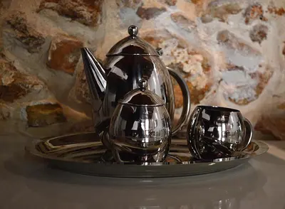a tray with a tea kettle and a cup on it at Casa al Bocca del Porto in Chania Town