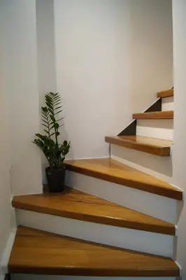 a potted plant on the stairs in a house at Casa al Bocca del Porto in Chania Town