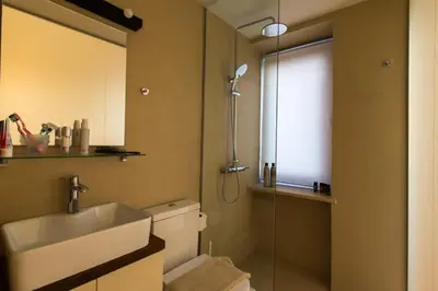 a bathroom with a toilet and a sink and a shower at Nonnalena Boutique Hotel in Chania Town