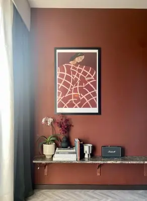 a wall with a picture and a shelf with books at TESSERA Urban Chania in Chania Town