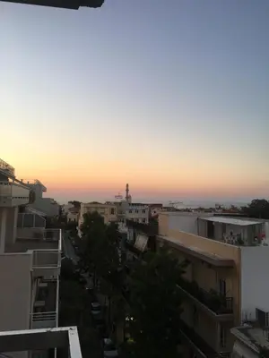 a view of a city skyline at sunset at DYO Urban Chania in Chania Town