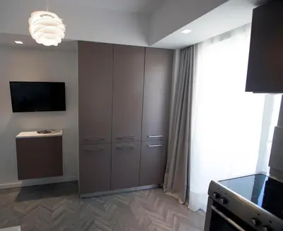 a room with a large cabinet and a television at DYO Urban Chania in Chania Town