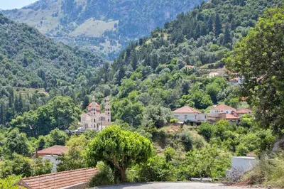 a small village in the mountains with a church at Villa Roxani in Mesklá