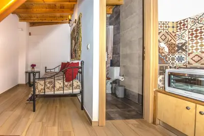 a small room with a bed and a bathroom at Fairytale Elafonisi in Elafonisi