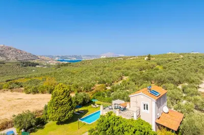 an aerial view of a house with a swimming pool at Villa Dimitris in Vlikhádha