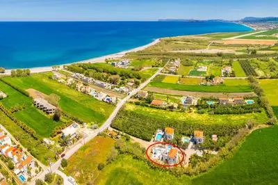an aerial view of a large estate next to the ocean at Villa Melina in Tavronitis
