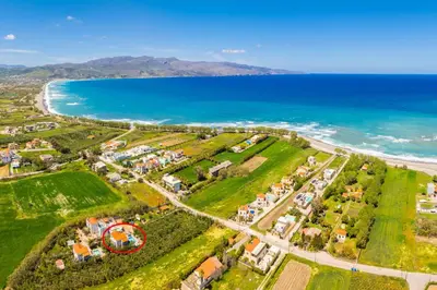 an aerial view of a resort near the ocean at Villa Tzina in Plataniás