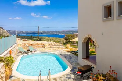 a swimming pool in the middle of a house at Villa Neria in Áptera