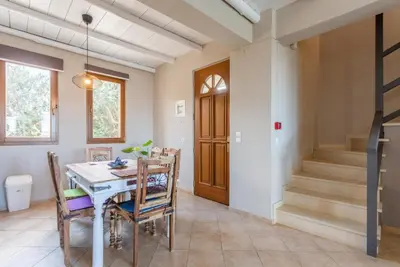 a dining room with a table and chairs at Villa Konstantina in Exopoli