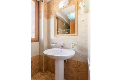 a bathroom with a sink and a mirror at Villa Konstantina in Exopoli