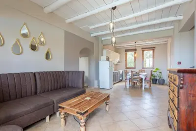 a living room with a couch and a table at Villa Konstantina in Exopoli