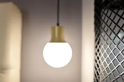 a light bulb hanging from a wall in a room at Nival Luxury Suites in Chania Town