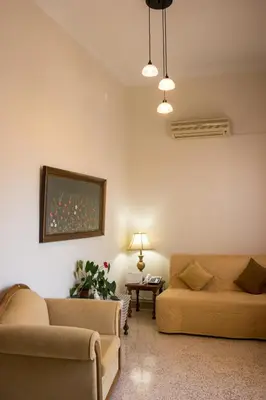 a living room with two couches and a table at Alexandra Apartment Near Chania Center in Chania Town