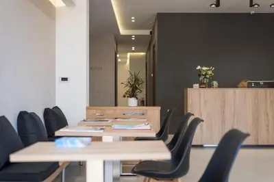 a meeting room with a table and chairs at Central City Hotel in Chania Town
