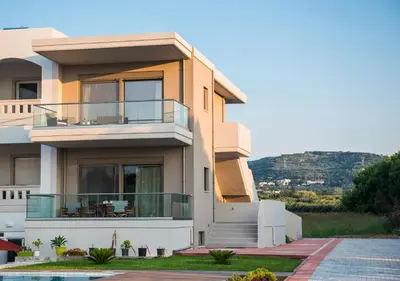 a house with a balcony with a view at Niovi Seaside Suites in Kissamos