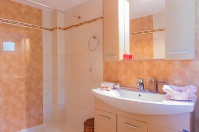 a bathroom with a sink and a shower at Villa Galata in Galatás