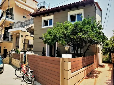 a bike parked in front of a house at Villa Galata in Galatás