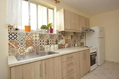 a kitchen with a sink and a counter top at Chrynigema in Chania Town