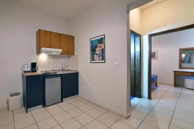 a kitchen with a sink and a counter at Akatos Hotel in Agia Marina Nea Kydonias