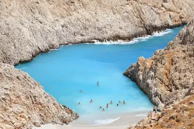 a group of people swimming in a body of water at Astrantia in Chania Town