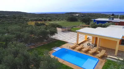 an aerial view of a house with a swimming pool at White Lake Holiday House in Elafonisi