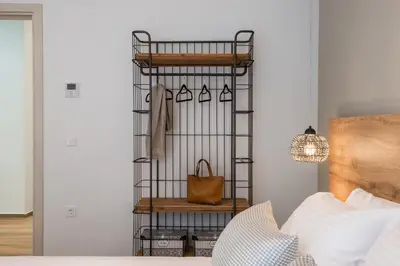 a closet with a iron shelf and a bag at No17 Pireos Street in Chania Town