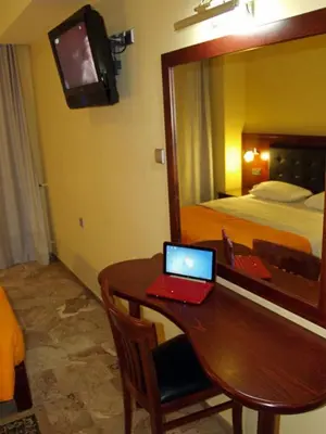 a room with a desk with a laptop on it at Hotel Filoxenia in Chania Town