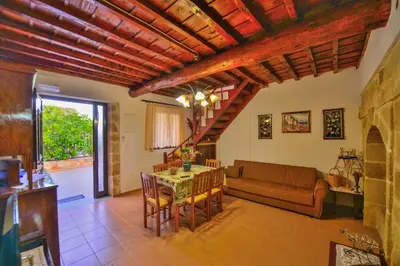 a living room with a couch and a table at Archontiko Ilias in Kavoúsion