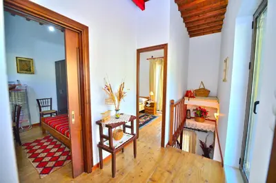 a living room with a couch and a table at Archontiko Ilias in Kavoúsion