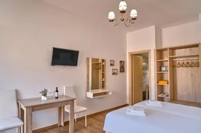 a living room with a couch and a table at Emmanouela's Apts in Kissamos