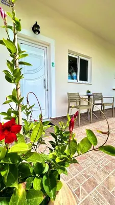a room with a table and chairs and a door at Emmanouela's Apts in Kissamos