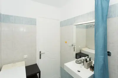 a bathroom with a sink and a mirror at Eleni Apartments in Chania Town