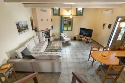 a living room with a couch and a table at Villa Adriana in Arménoi