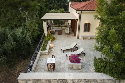 an overhead view of a patio with tables and chairs at Koukounari luxury villa in Chania Town