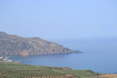 a view of a large body of water with mountains at Captain Nikolas in Keramotí