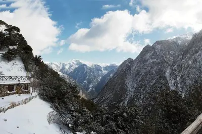 a view of a snowy mountain range with snow covered mountains at Mike Omalos Houses in Omalós