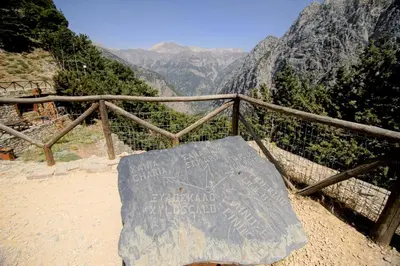 a sign that is sitting on top of a mountain at Mike Omalos Houses in Omalós