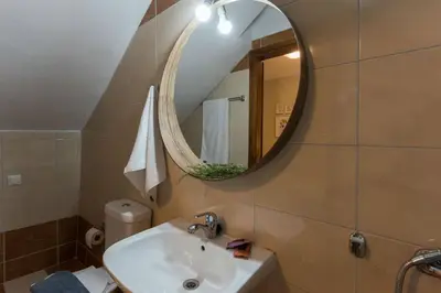 a bathroom with a sink and a mirror at Margiani House in Kaláthenai