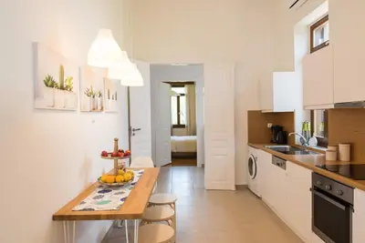 a kitchen with a wooden table in a room at Villa Filoxenia 1937 in Gerani Chanion