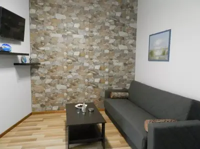 a living room with a couch and a table at Agora Apartment First Floor in Kissamos