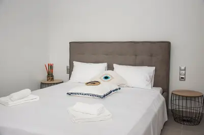 a bedroom with a bed with a stuffed animal on it at Christina Apartment in Kissamos