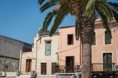 a palm tree in front of a building at Casa Irene in Chania Town