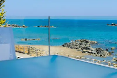 a view of the ocean from a room at Sonja Beachfront Apartments in Kato Daratso