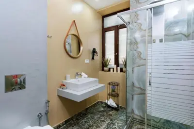 a bathroom with a sink and a shower at Diamond Luxury Suites in Chania Town