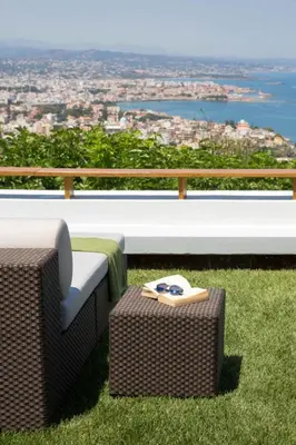 a bench with a table and a chair and a view at VILLA TERRA CRETA Luxury Retreat and Spa in Chania Town